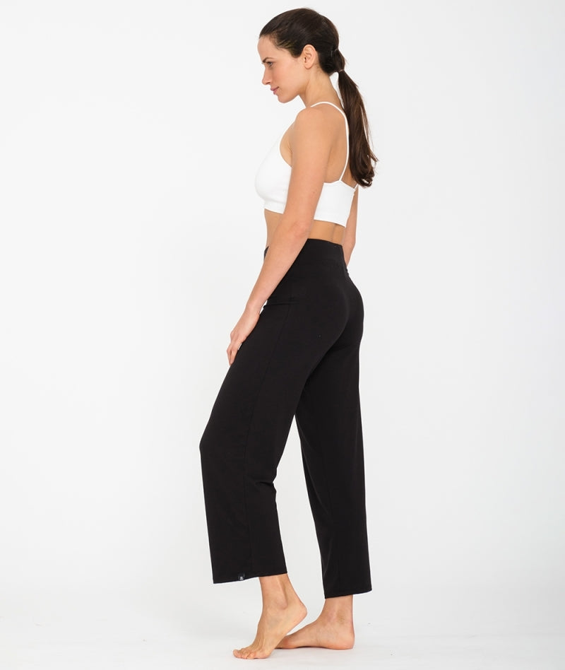 Women wearing black flared cut  yoga jersey pants in lyocell & cotton